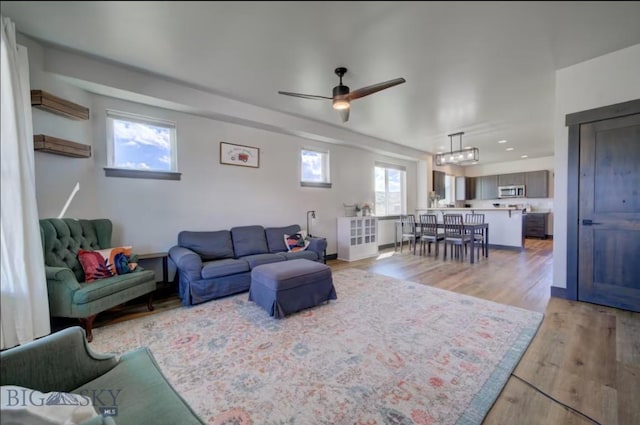 421 Otis Ave, Ennis, MT 59729 - living area featuring light wood-style flooring, healthy amount of natural light, a ceiling fan, and recessed lighting