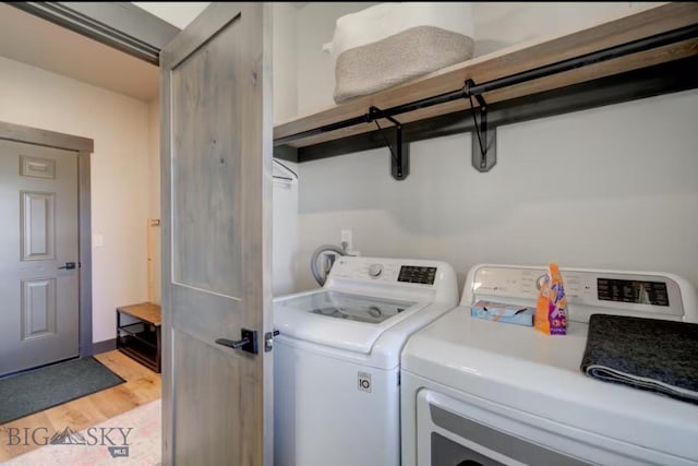 421 Otis Ave, Ennis, MT 59729 - laundry area featuring separate washer and dryer and light wood finished floors