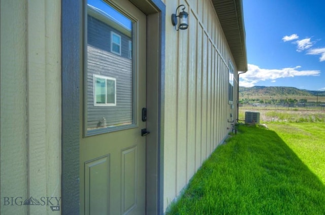 421 Otis Ave, Ennis, MT 59729 - view of property exterior featuring a lawn and a mountain view