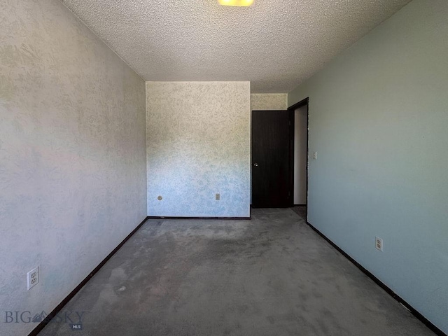 1716 S Rouse, Bozeman, MT 59715 - carpeted spare room with a textured ceiling and baseboards