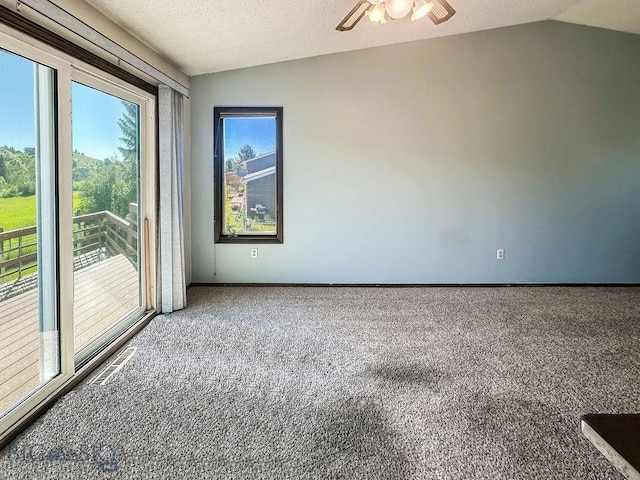 1716 S Rouse, Bozeman, MT 59715 - spare room featuring carpet, vaulted ceiling, and a ceiling fan