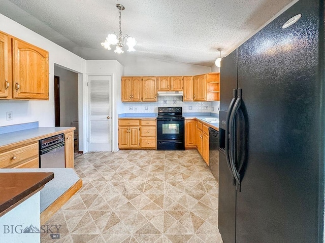 1716 S Rouse, Bozeman, MT 59715 - kitchen featuring black appliances, a chandelier, vaulted ceiling, under cabinet range hood, and a textured ceiling