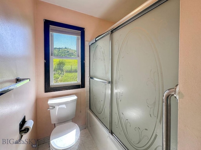 1716 S Rouse, Bozeman, MT 59715 - bathroom featuring toilet and bath / shower combo with glass door