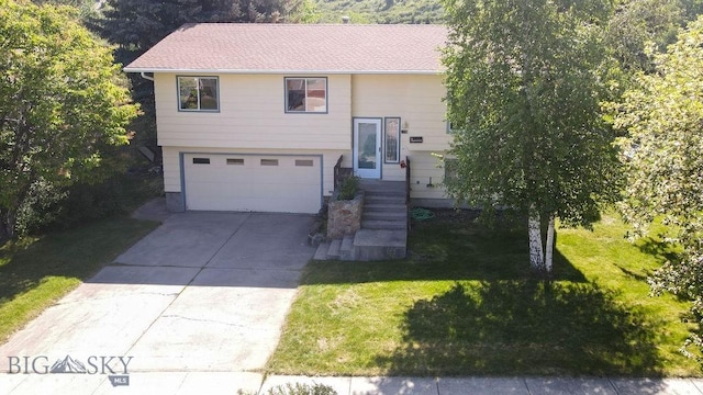 1716 S Rouse, Bozeman, MT 59715 - split foyer home featuring driveway, an attached garage, and a front lawn