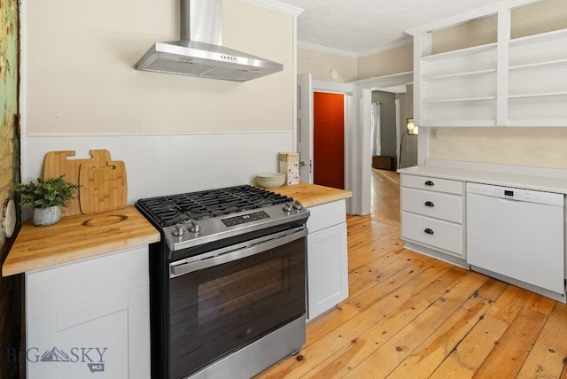 606 S Washington St, Dillon, MT 59725 - kitchen with gas stove, wall chimney range hood, white dishwasher, ornamental molding, and open shelves
