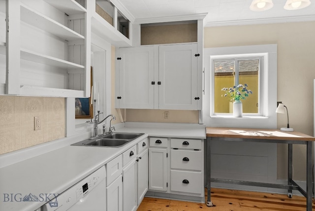 606 S Washington St, Dillon, MT 59725 - kitchen featuring dishwasher, open shelves, light countertops, white cabinets, and ornamental molding