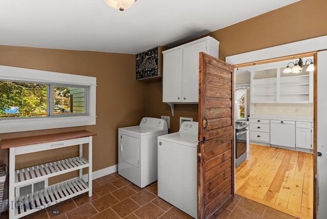 606 S Washington St, Dillon, MT 59725 - laundry room featuring cabinet space, washer and clothes dryer, a chandelier, and tile patterned floors