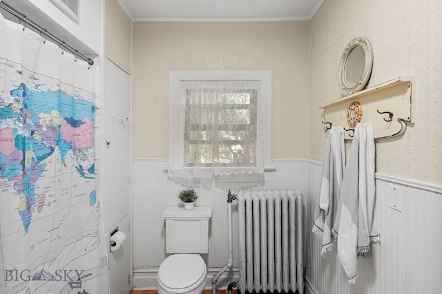 606 S Washington St, Dillon, MT 59725 - bathroom with radiator heating unit, a wainscoted wall, ornamental molding, and a shower with shower curtain