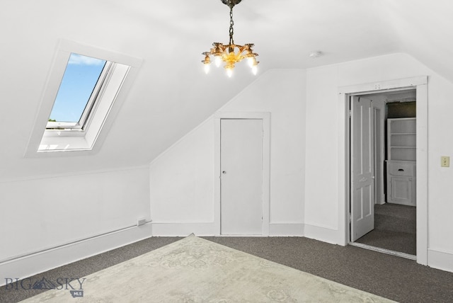 606 S Washington St, Dillon, MT 59725 - additional living space featuring lofted ceiling, carpet flooring, a skylight, and a chandelier