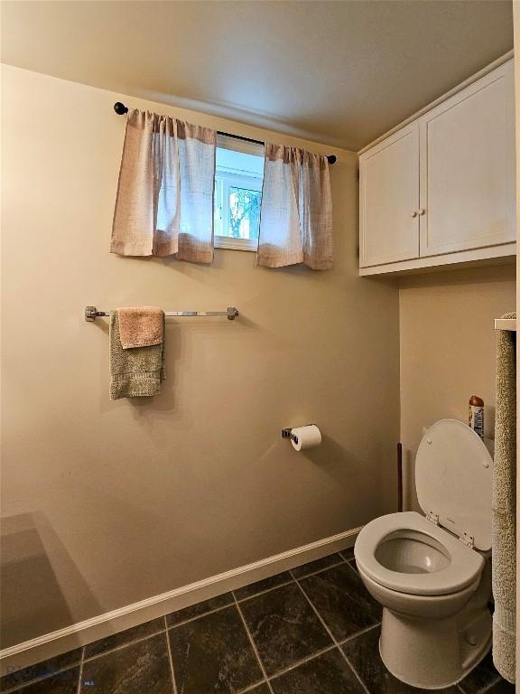 201 W 8th Ave, Big Timber, MT 59011 - bathroom featuring baseboards and tile patterned floors