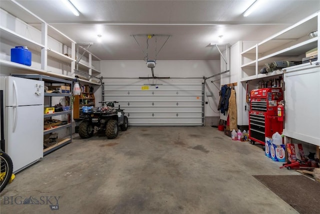 201 W 8th Ave, Big Timber, MT 59011 - garage with freestanding refrigerator and a garage door opener