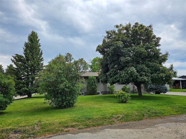 201 W 8th Ave, Big Timber, MT 59011 - obstructed view of property featuring a front lawn