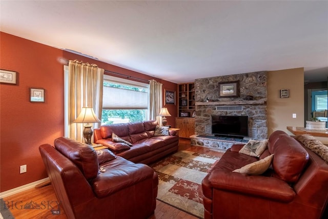 201 W 8th Ave, Big Timber, MT 59011 - living area with wood finished floors and a stone fireplace