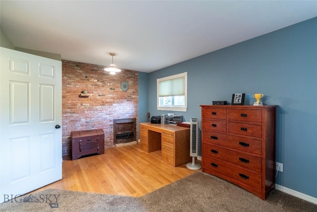 201 W 8th Ave, Big Timber, MT 59011 - office area featuring a wood stove and light wood-style flooring