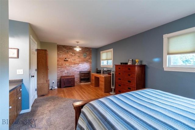 201 W 8th Ave, Big Timber, MT 59011 - bedroom with a wood stove and light carpet