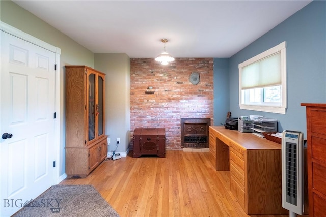 201 W 8th Ave, Big Timber, MT 59011 - office space featuring light wood-style flooring, brick wall, and heating unit