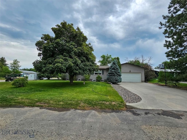 201 W 8th Ave, Big Timber, MT 59011 - view of front of house featuring concrete driveway, a front yard, and a garage