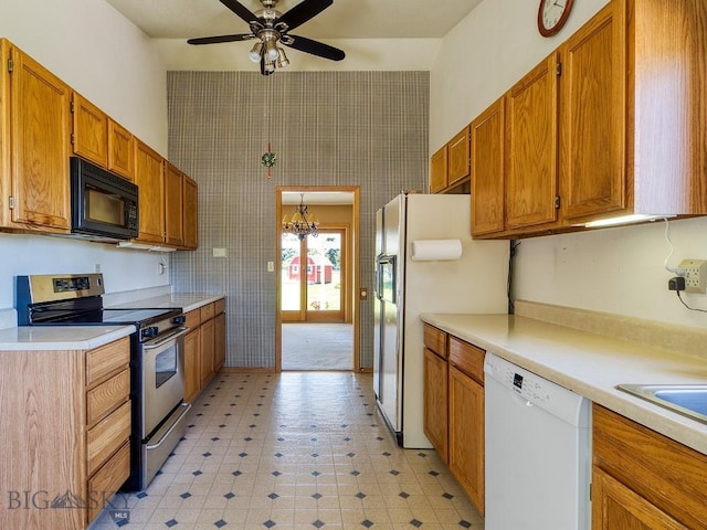 353 Sacajawea Peak Dr, Bozeman, MT 59718 - kitchen featuring white dishwasher, stainless steel range with electric cooktop, black microwave, refrigerator with ice dispenser, and ceiling fan