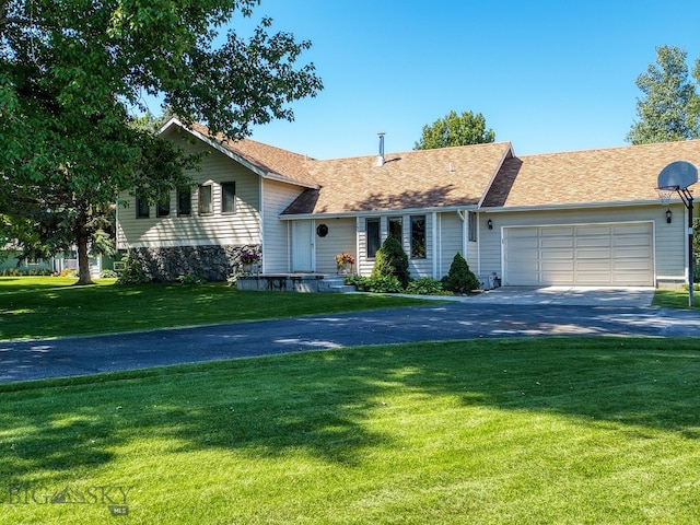 353 Sacajawea Peak Dr, Bozeman, MT 59718 - split level home featuring driveway, an attached garage, a front yard, and roof with shingles
