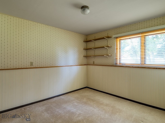 353 Sacajawea Peak Dr, Bozeman, MT 59718 - empty room with light carpet and wallpapered walls
