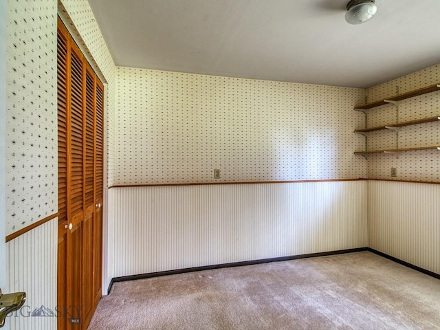 353 Sacajawea Peak Dr, Bozeman, MT 59718 - spare room with carpet flooring and wallpapered walls