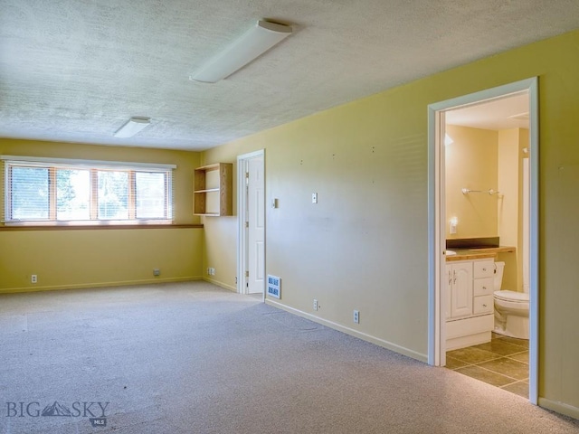 353 Sacajawea Peak Dr, Bozeman, MT 59718 - spare room with carpet and a textured ceiling