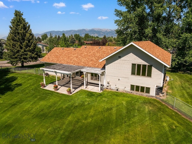 353 Sacajawea Peak Dr, Bozeman, MT 59718 - rear view of property featuring a pergola, a patio area, a mountain view, and a fenced backyard