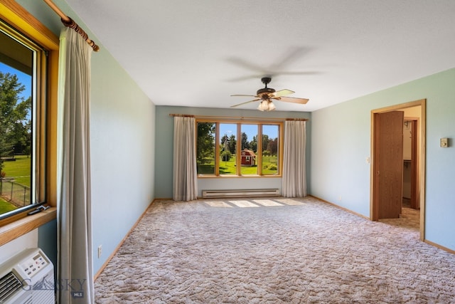 353 Sacajawea Peak Dr, Bozeman, MT 59718 - unfurnished living room featuring a baseboard radiator, a ceiling fan, and carpet