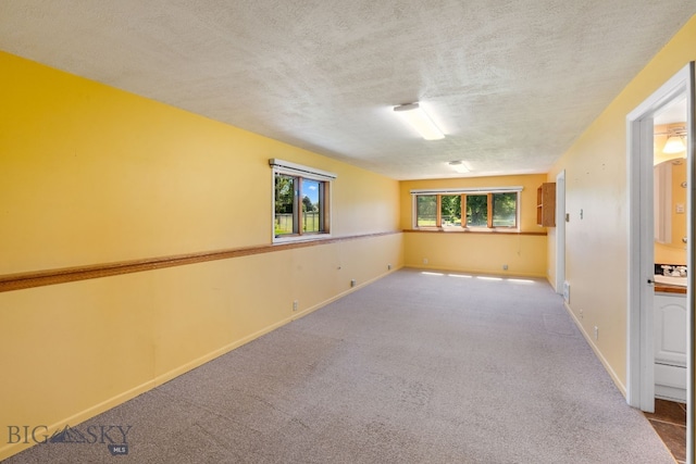353 Sacajawea Peak Dr, Bozeman, MT 59718 - carpeted spare room with a textured ceiling and baseboards