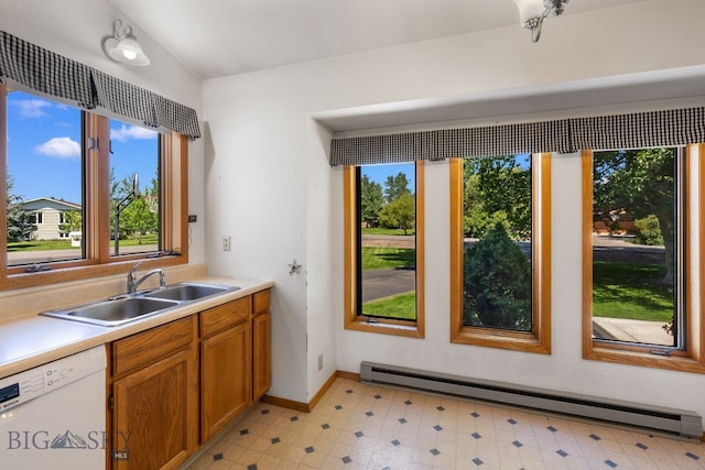 353 Sacajawea Peak Dr, Bozeman, MT 59718 - kitchen featuring dishwasher, a baseboard heating unit, brown cabinets, light flooring, and light countertops