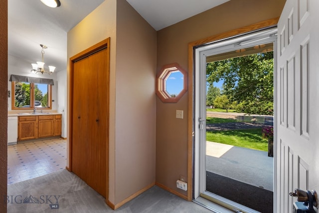 353 Sacajawea Peak Dr, Bozeman, MT 59718 - foyer entrance with plenty of natural light, a chandelier, and light floors