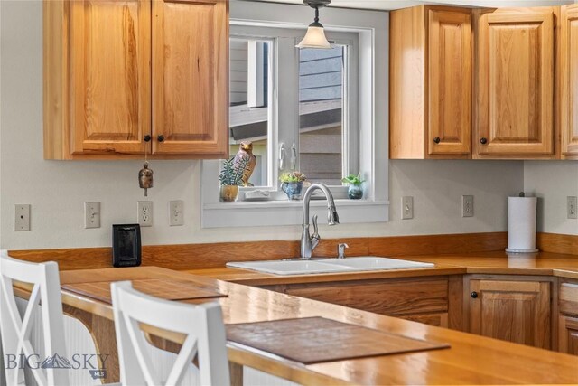 818 N 13th St, Livingston, MT 59047 - kitchen featuring light countertops, healthy amount of natural light, and pendant lighting