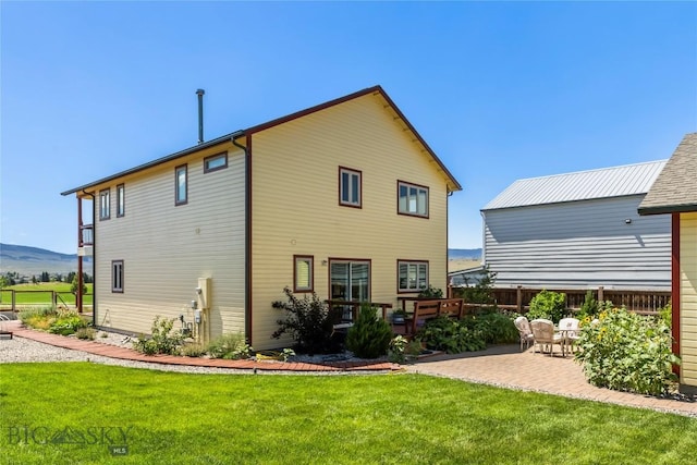 818 N 13th St, Livingston, MT 59047 - back of house with a patio and a mountain view