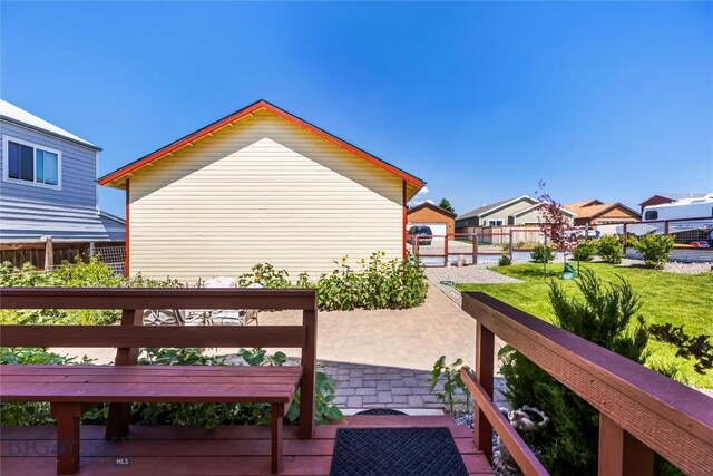 818 N 13th St, Livingston, MT 59047 - wooden terrace featuring a patio and a residential view