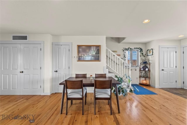 818 N 13th St, Livingston, MT 59047 - dining room featuring stairway, wood finished floors, and recessed lighting