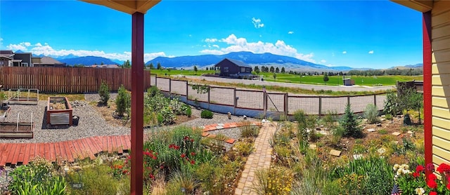 818 N 13th St, Livingston, MT 59047 - fenced backyard featuring a vegetable garden and a mountain view
