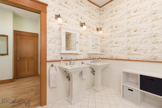 526 Chief Joseph, Big Sky, MT 59716 - bathroom with wallpapered walls, a wainscoted wall, tile patterned floors, and ornamental molding