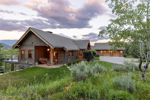 526 Chief Joseph, Big Sky, MT 59716 - view of front of home with a lawn and a patio area