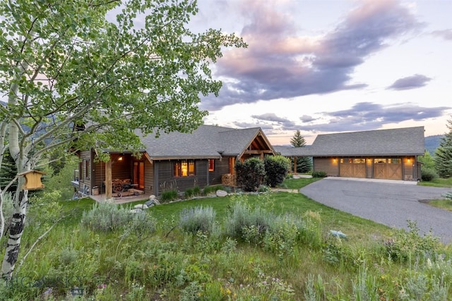 526 Chief Joseph, Big Sky, MT 59716 - view of front of home with asphalt driveway and roof with shingles