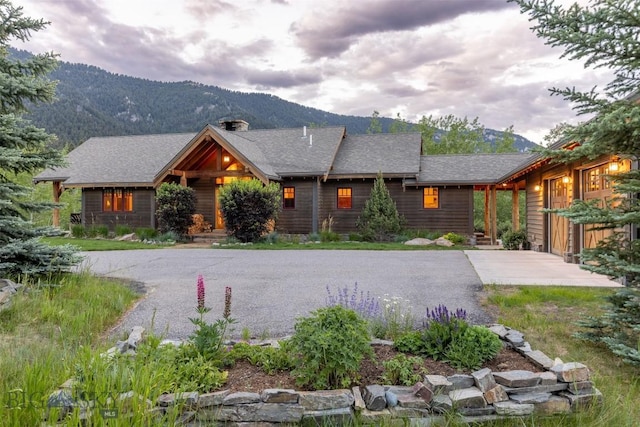 526 Chief Joseph, Big Sky, MT 59716 - chalet / cabin with a mountain view and gravel driveway