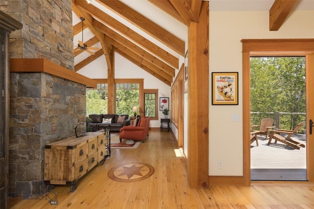526 Chief Joseph, Big Sky, MT 59716 - living area featuring beamed ceiling, wood-type flooring, high vaulted ceiling, and a ceiling fan