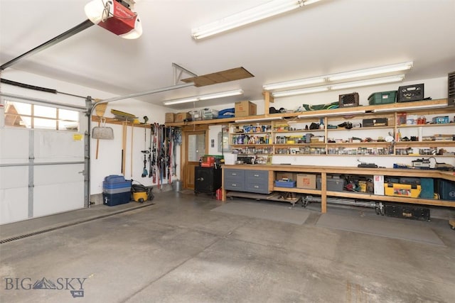 526 Chief Joseph, Big Sky, MT 59716 - garage with a garage door opener and a workshop area