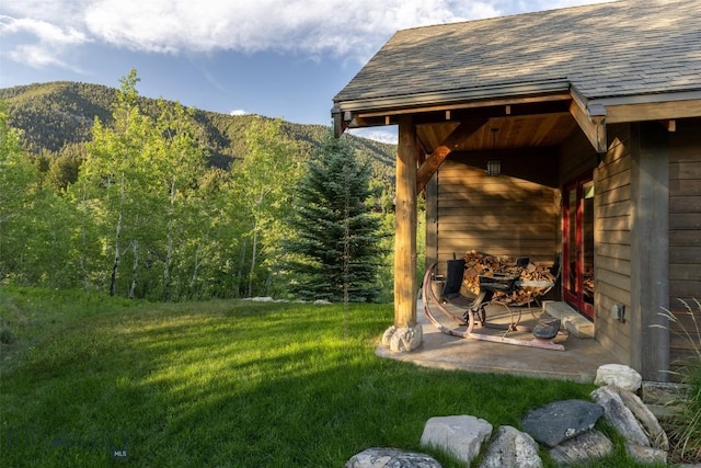 526 Chief Joseph, Big Sky, MT 59716 - view of green lawn with a forest view and a mountain view