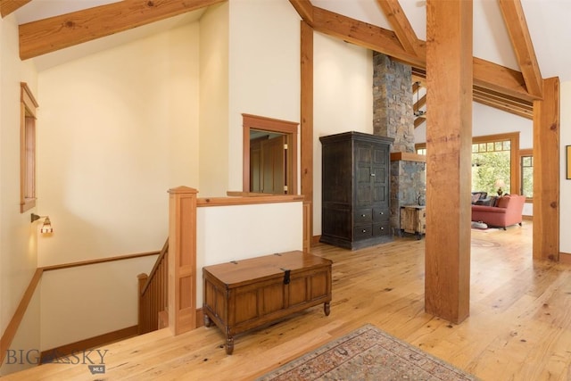 526 Chief Joseph, Big Sky, MT 59716 - stairway featuring beam ceiling, hardwood / wood-style floors, and high vaulted ceiling
