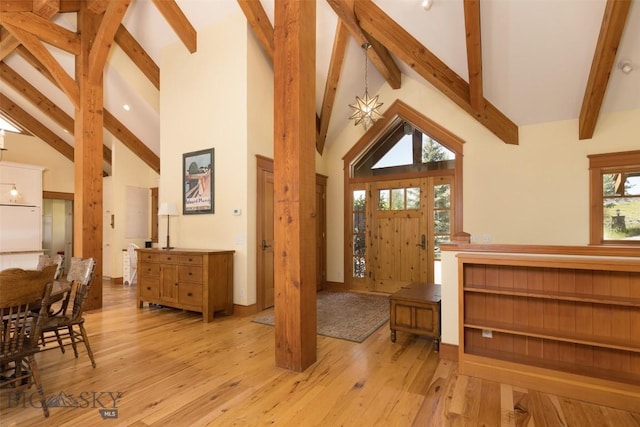526 Chief Joseph, Big Sky, MT 59716 - foyer featuring beamed ceiling, light wood-style floors, and high vaulted ceiling
