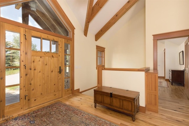526 Chief Joseph, Big Sky, MT 59716 - entrance foyer with light wood-type flooring, beamed ceiling, and high vaulted ceiling