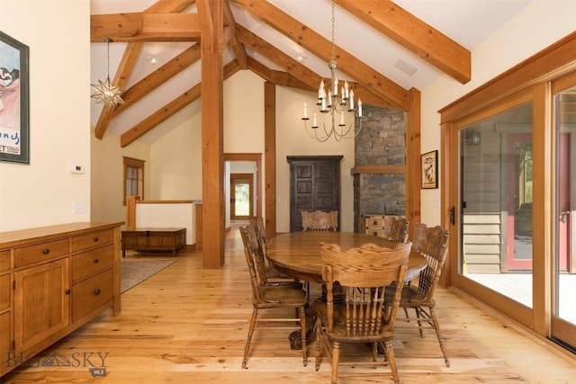 526 Chief Joseph, Big Sky, MT 59716 - dining room with a chandelier, beam ceiling, high vaulted ceiling, and light wood finished floors