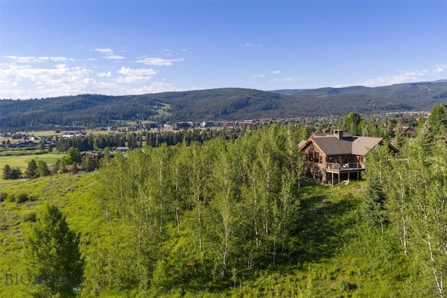 526 Chief Joseph, Big Sky, MT 59716 - view of mountain background featuring a heavily wooded area