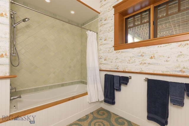 526 Chief Joseph, Big Sky, MT 59716 - full bath with tiled shower / bath combo, wainscoting, and wallpapered walls