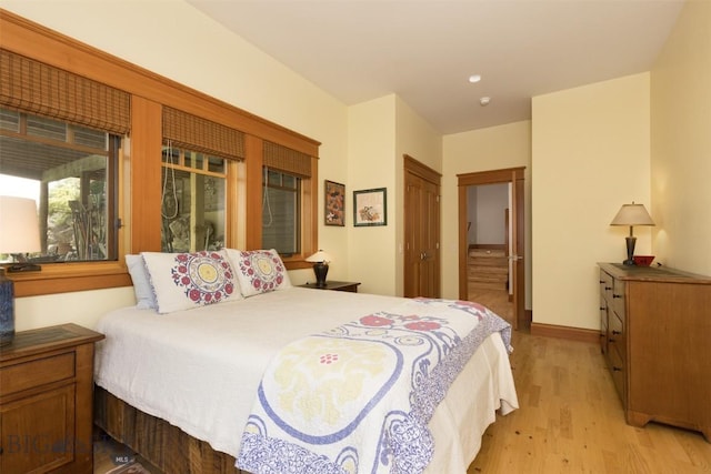 526 Chief Joseph, Big Sky, MT 59716 - bedroom with light wood finished floors and ensuite bathroom